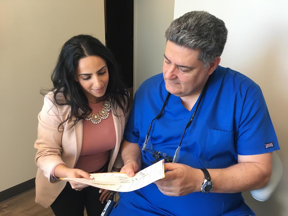 Doctor reviewing treatment plan with a patient at Millennium Park Smiles