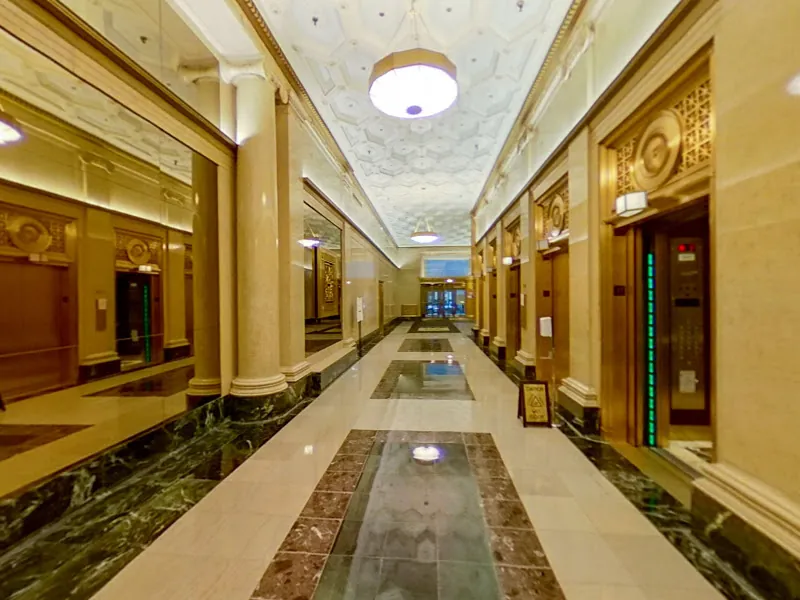 Elegant marble lobby of 25 E. Washington, home of Millennium Park Smiles