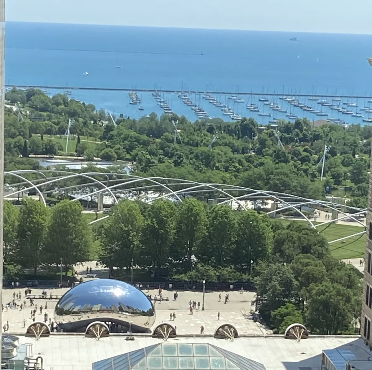 View from Millennium Park Smiles looking out over Cloud Gate, Pritzker Pavilion, and Lake Michigan